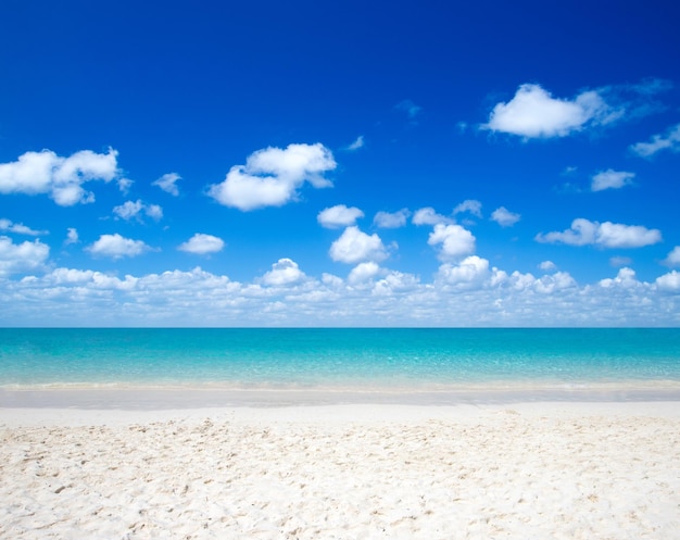 Blue sea under clouds sky