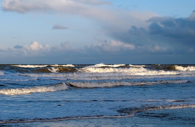 Blue sea or ocean in the morning with white clouds on the blue sky calm scenery on the beach