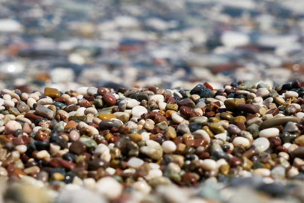 Blue sea and pebbles background