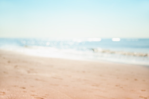 Blue sea and sandy beach. Blurred background. Travel and vacation