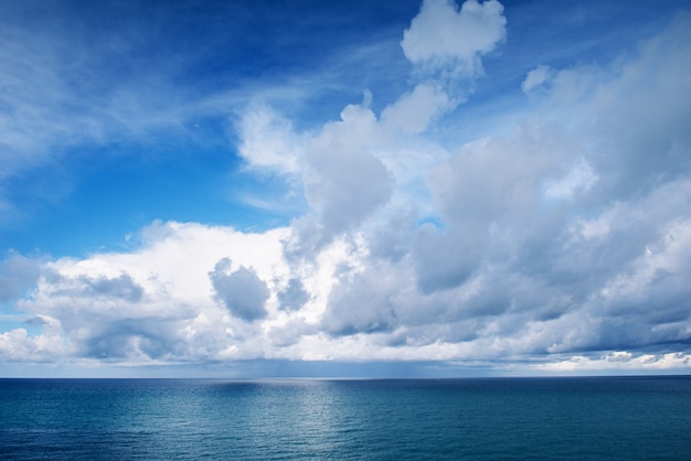 Blue sea and white clouds in the sky