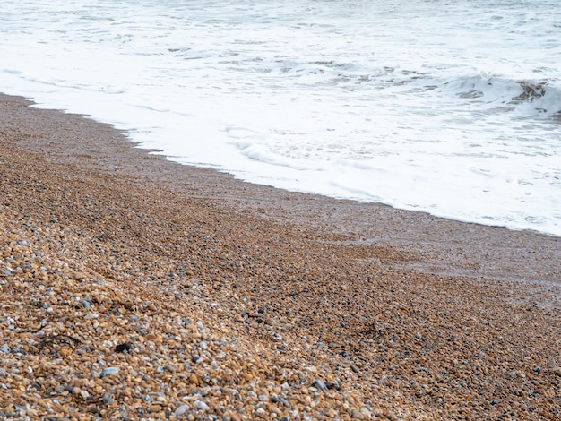 Blue sea with waves and sandy shore beautiful natural seascape