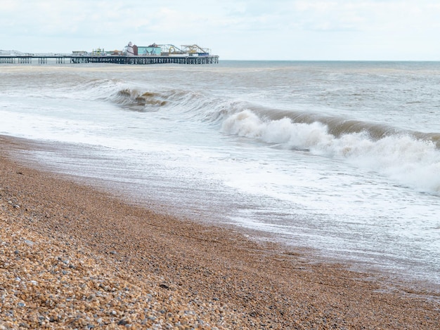 Blue sea with waves and sandy shore beautiful natural seascape