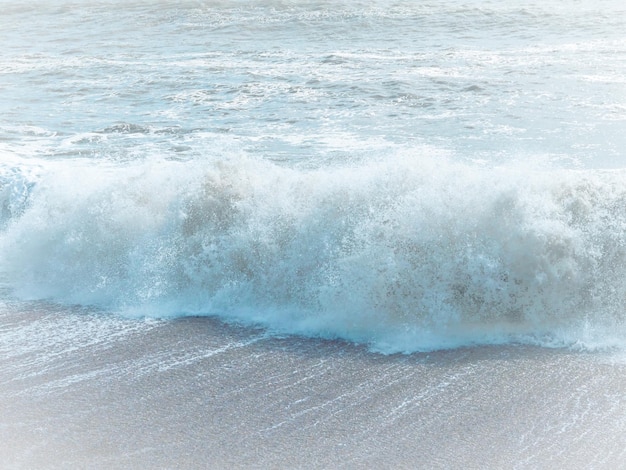 Blue sea with waves and sandy shore beautiful natural seascape