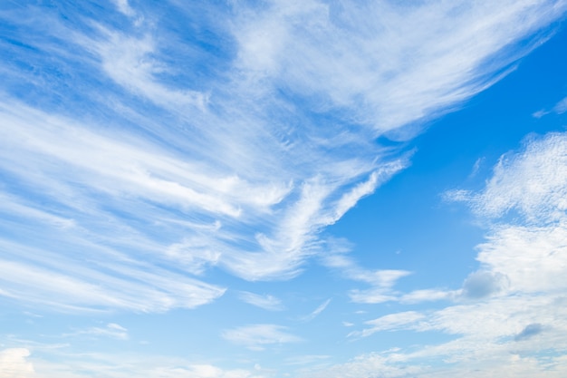 Blue sky background texture with white clouds.