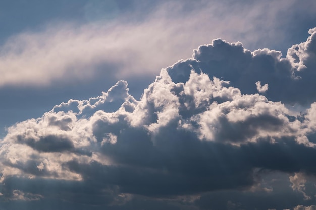 Blue sky background with big white tiny stratus cirrus striped clouds