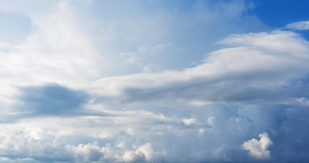 Blue sky background with clouds. Close up.