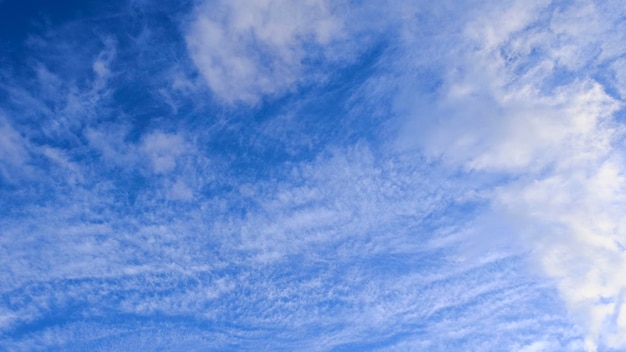 blue sky background with fuzzy clouds