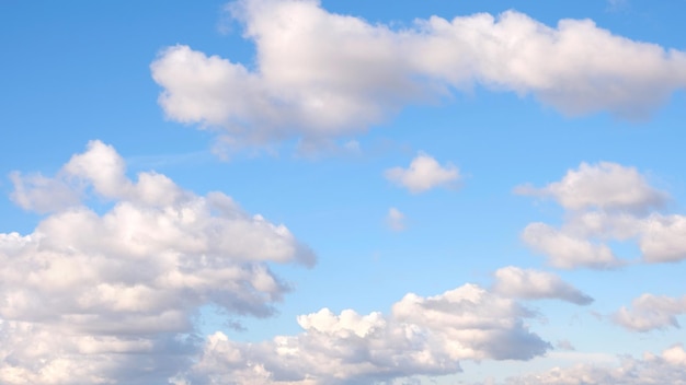 Blue sky background with tiny clouds