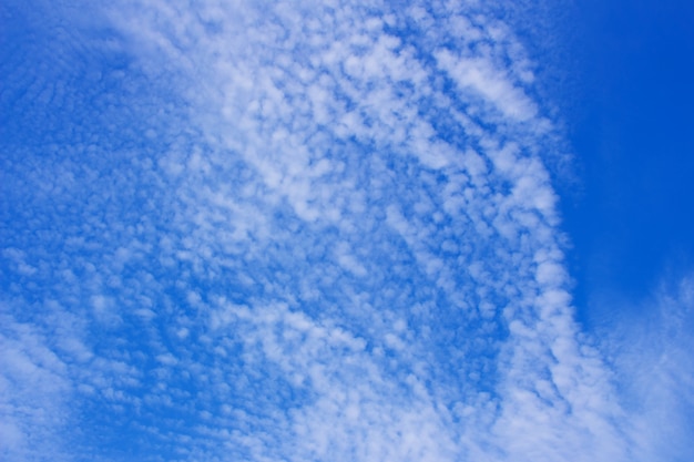 Blue sky background with a tiny clouds