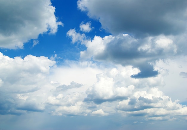 Blue sky background with tiny clouds