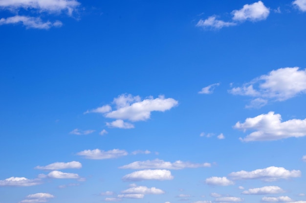 Blue sky background with a tiny clouds