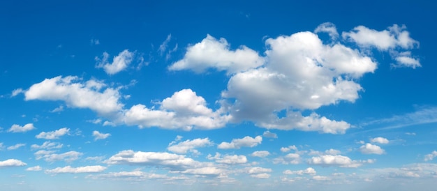 Blue sky background with tiny clouds