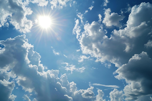 Blue sky background with white clouds and sun Cumulus clouds