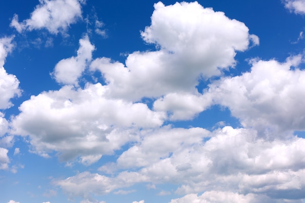 Blue sky background with white clouds.