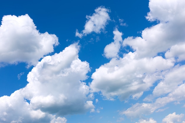 Blue sky background with white clouds.