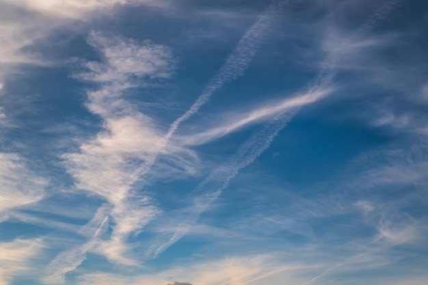 Blue sky background with white striped clouds in heaven and infinity may use for sky replacement