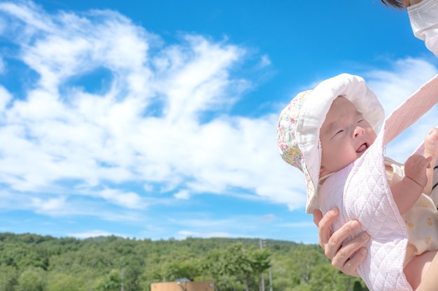 Blue sky and a cute baby