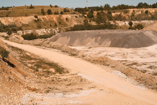 Blue sky and midday sun over quarry