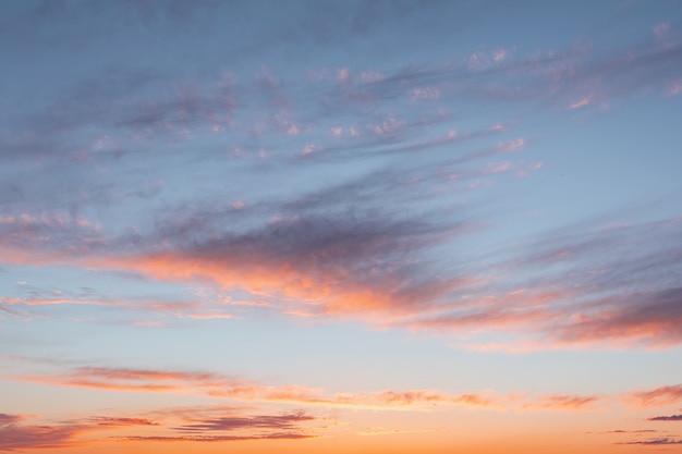 Blue sky at sunset with bright stains of purple and pink