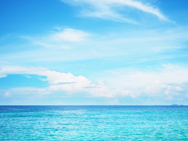 Blue sky and white cloud over blue ocean surface