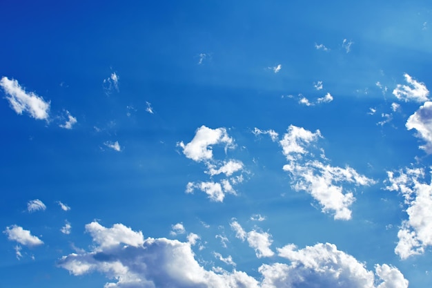 Blue sky with beautiful clouds and sun rays