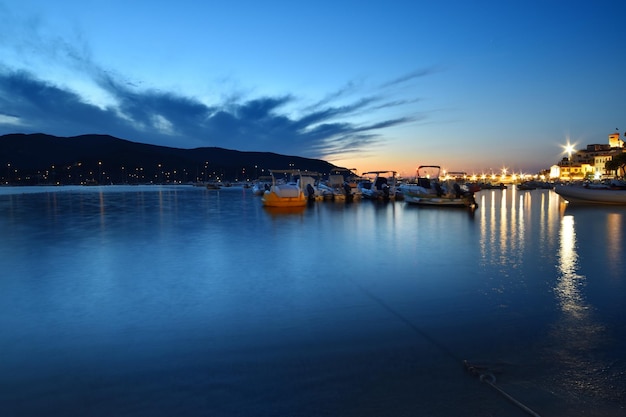 A blue sky with clouds and a boat in the foreground