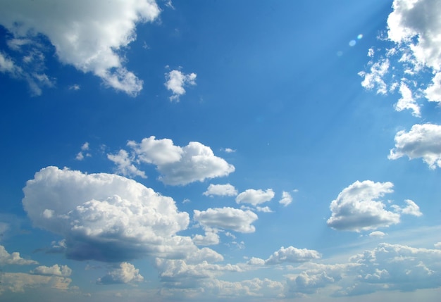 Blue sky with clouds and sun