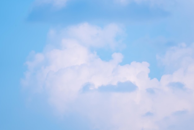 A blue sky with clouds and a white cloud