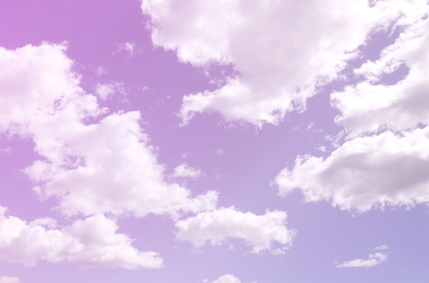 A blue sky with lots of white clouds of different sizes