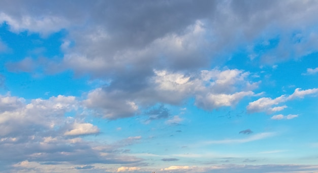 Blue sky with white clouds in sunny weather.