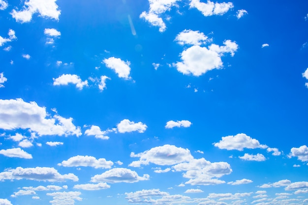 Blue sky  with white fluffy clouds