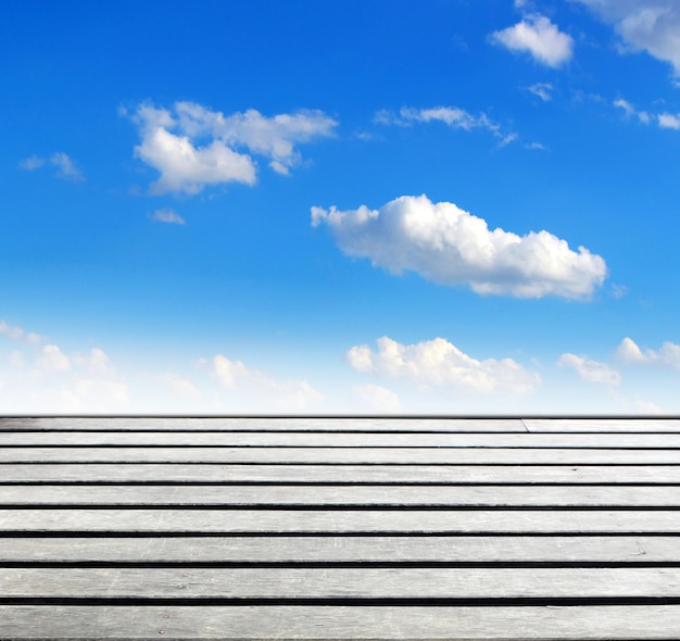 Blue sky and wood floor background