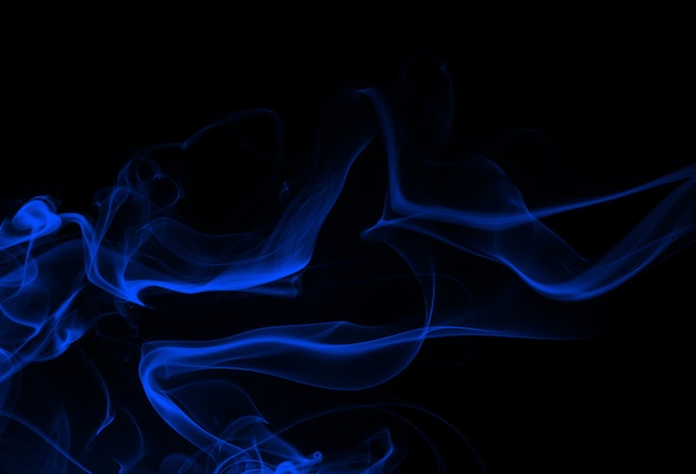 Blue smoke abstract on black background, darkness concept