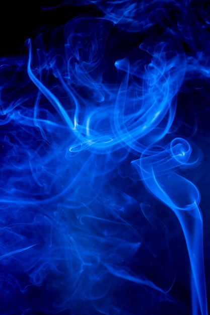 Blue smoke motion on black background.