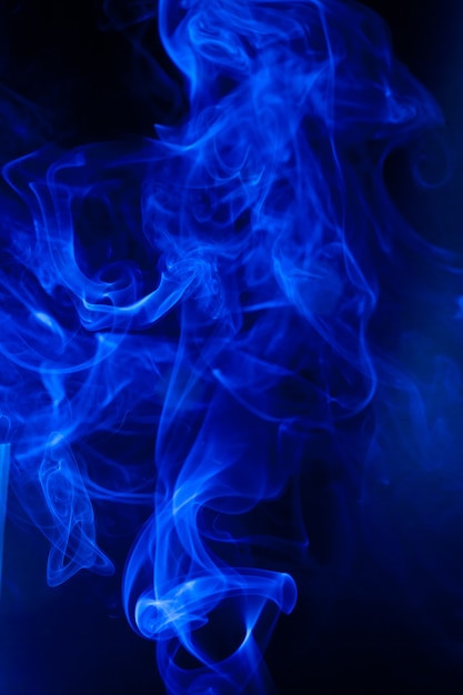 Blue smoke motion on black background.