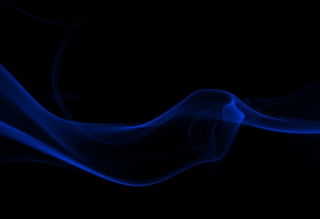 Photo blue smoke movement abstract on black background darkness concept