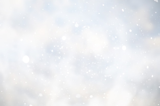 Blue snowfall bokeh background, abstract snowflake background blurred abstract blue