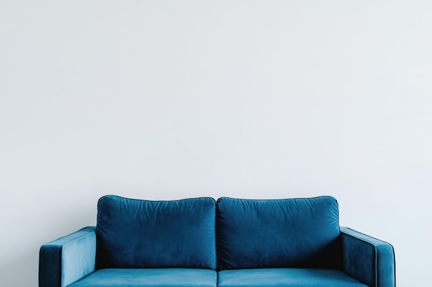 Photo blue sofa against a white wall