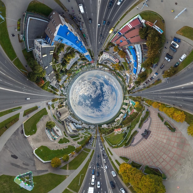 Blue sphere inside overlooking old town urban development historic buildings and crossroads with cars Transformation of spherical 360 panorama in abstract aerial view