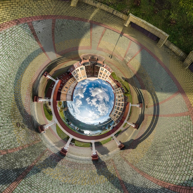 Blue sphere inside overlooking old town urban development historic buildings and crossroads with cars Transformation of spherical 360 panorama in abstract aerial view