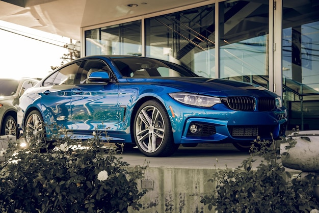 Blue sports car in a car dealership