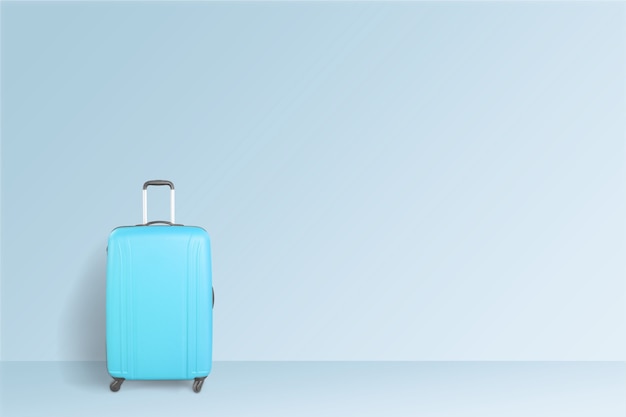 Blue suitcase on blue background