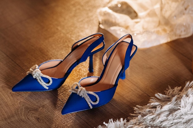 Blue summer women's shoes lying on the floor Festive highheeled shoes