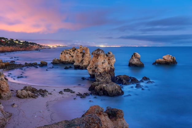 Blue sunset in the south of Portugal golden rocks of Algarve Europe