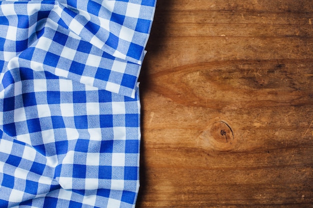 blue table cloth on wooden background