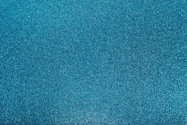 Blue texture background with sparkles. Festive glitter background