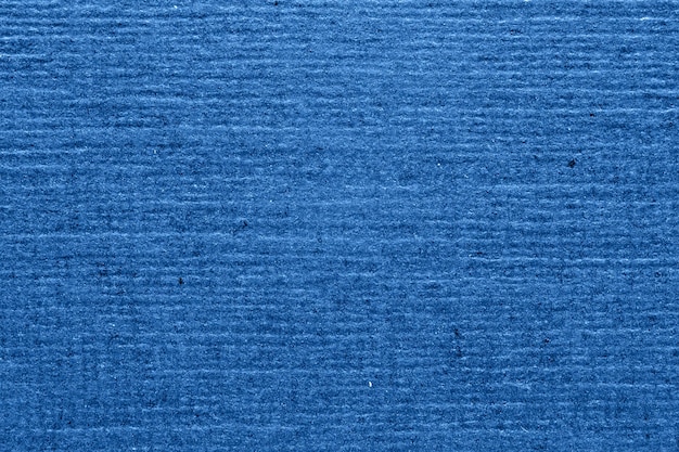 Blue textured paper background closeup Striped grainy background for design