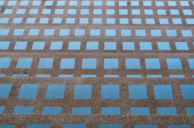 A blue tile floor with squares on it and the word " water " on it.