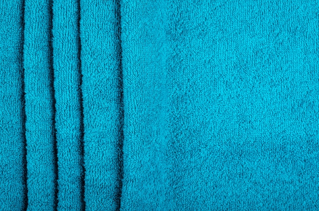 Blue towel fabric texture, top view photo.